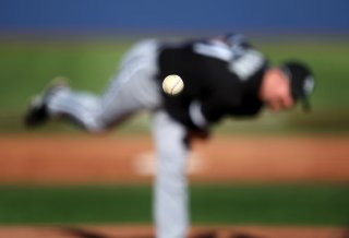 Chicago White Sox pitcher Scott Linebrink delivers a pitch against the Chicago Cubs during the fifth inning of a spring training baseball game in Las Vegas, in this March 5, 2009 photo. (AP Photo/Isaac Brekken, File) #